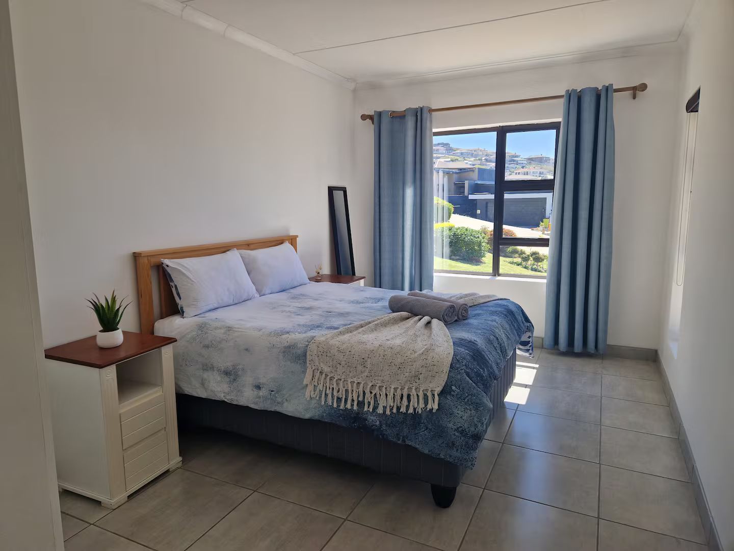 Bedroom with blue bedspread